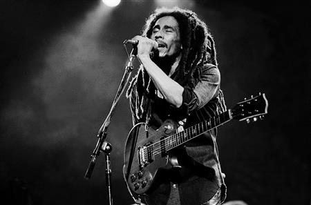 Bob Marley playing the guitar. (http://www.largeup.com/2014/04/02/legend-shepard-f ())